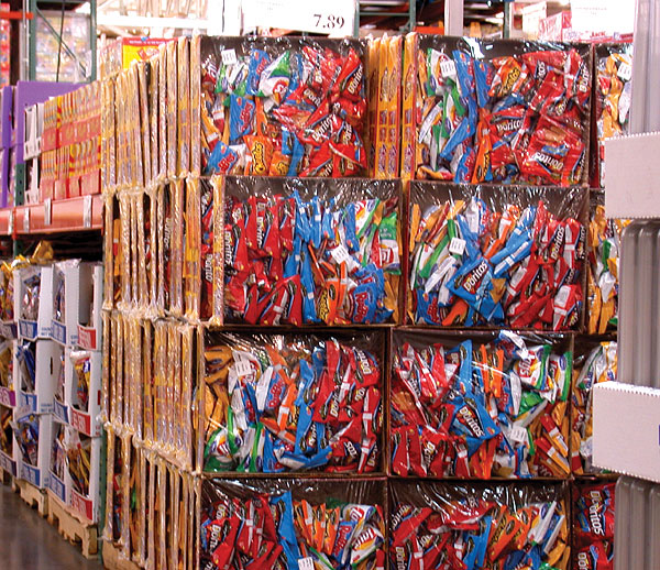 A bulk display from Frito-Lay gains attention in club stores. It uses printed, solid fiber trays and a glossy, high-clarity film