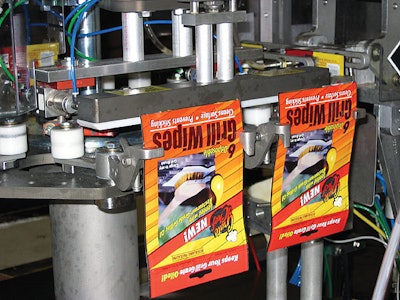 The Grill Wipes pads are pouched on a compact, four-station rotary machine that includes a customized filling station seen on t