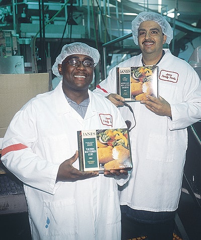 Leonard Cole (above left), North York plant manager, and Nick Boragina, Concord plant manager, display cartons of IQF product at