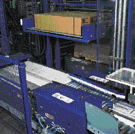 Cases are formed into rows (top) on a slider plate that moves a layer of cases (above) onto the stretch wrapper part of the pall