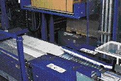 Cases are formed into rows (top) on a slider plate that moves a layer of cases (above) onto the stretch wrapper part of the pall