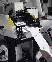 The LLDPE bags-on-a-roll are printed off-line with label formats stored on a PC. The spool of printed bags are then mounted onto