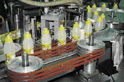 In the station shown above, thermally conditioned injection-molded preforms are being handed off to the portion of the bottle-ma