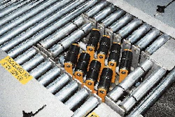 Cases are configured in a variety of formats by means of the case turner (inset) running just ahead of the automatic palletizer