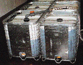 A galvanized steel cage permits Pepper Source personnel to see through to the inner HDPE liner to gauge product level