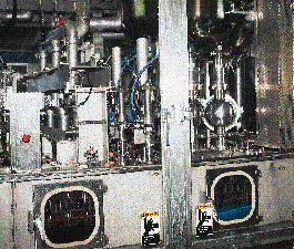 Cartons are presterilized, filled and sealed within the aseptic chamber, which runs along the bottom of the system