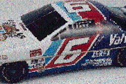 The two-piece tin (top) looks like a scale model of the race car. Even the bottom (above) is printed and formed to look like the