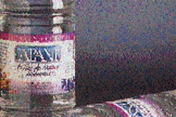 Molds open (top) to reveal the injection-molded PET preforms, which are subsequently conditioned and stretch/blow molded into fi