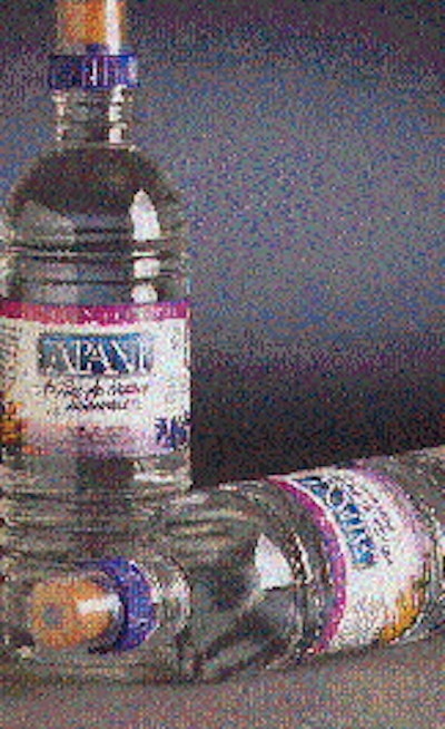 Molds open (top) to reveal the injection-molded PET preforms, which are subsequently conditioned and stretch/blow molded into fi