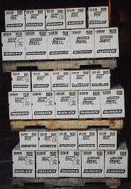 Many retailers order small quantities to minimize inventories, as these stacked pallets of corrugated cases suggests