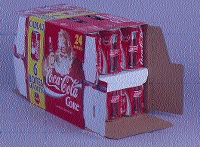 At left, an operator makes an adjustment at the control panel of Coca-Cola France?s new ?twin-stack? cartoner. A promotional