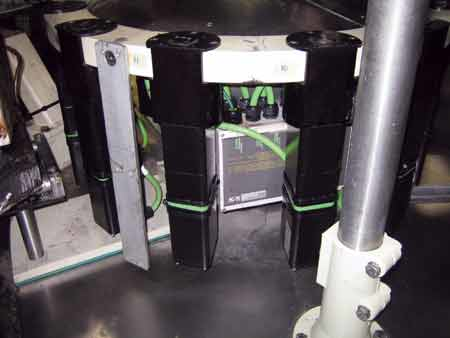 SERVO INTEGRATION. K2 milled the labeler's bottle table (above) to accept these quick-change modular servo cartridges that contr