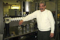 K2 Engineering Group's Dan Feest with a Krones labeler servo retrofit in progress. He's pointing out examples of the various bo