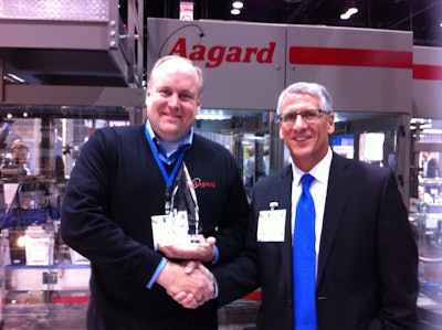 Aagard's Steve Mulder receives an award from Packaging World publisher Joe Angel.