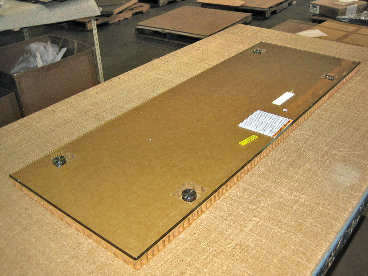 1. Glass panel is placed on 1-in. piece of honeycomb, cut slightly larger than the glass.