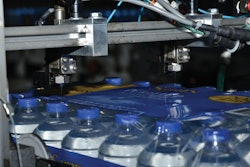 TIDY WAREHOUSE. Neat stacks of warehoused cases are now a reality since the water-based palletizing adhesive went into use at Premium Waters.