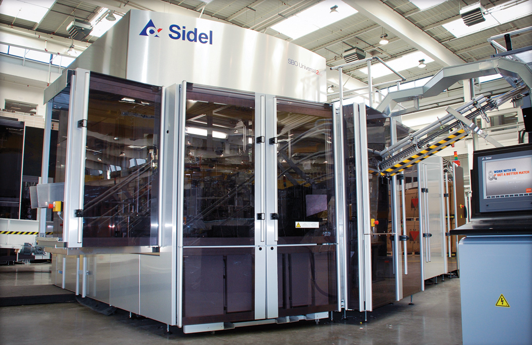 REDESIGNED OVENS. The new 16-station blow-molding machine uses fewer oven modules and fewer lamps per module to decrease oven power consumption by more than 45%.