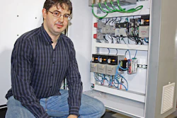 AFA Electrical Engineer David Langen appreciates the unique method of communicating over the Internet on which the COSY VPN router (identified as A in photo) relies.