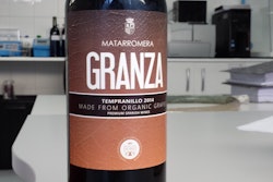 A 750-mL wine bottle that is injection stretch blow molded of PLA.