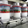 LINEAR SYSTEM. Exiting the in-line linear system, filled and lidded single-serve cups are picked 36 at a time and placed into la