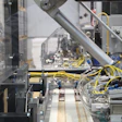A two-axis robot uses vacuum pickup to transfer Neapolitans from the counter molds and place them on the infeed belt of the pack