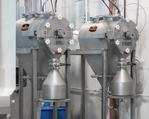 One pressurized Centri-Sifter centrifugal sifter is dedicated to screening of white flour&mdash;the other for screening of whole wheat flour. Photo: Kason Corporation.