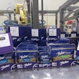 The shelf-ready Cabrio Case is packed with pouches in a variety of configurations using a six-axis robot (in background).