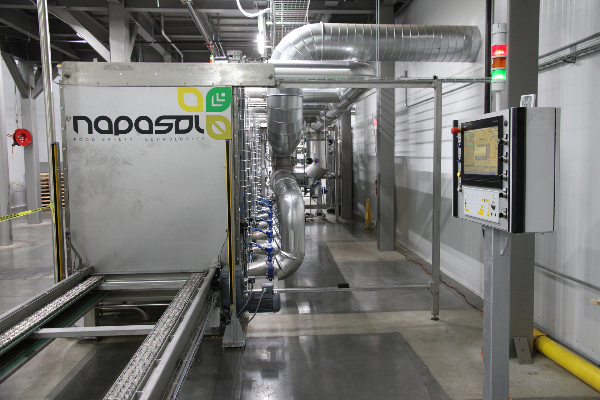 The Napasol pasteurization unit produces approximately 9 million kernel pounds of walnuts a month. Shown here is the loading side of the pasteurization unit where walnuts enter from a silo tank farm. Photo courtesy of Poindexter Nut Co.