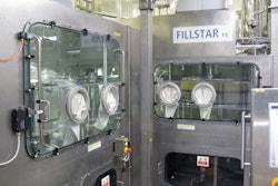 The class 100 sterile chamber of the aseptic filler can be accessed through the glove ports.