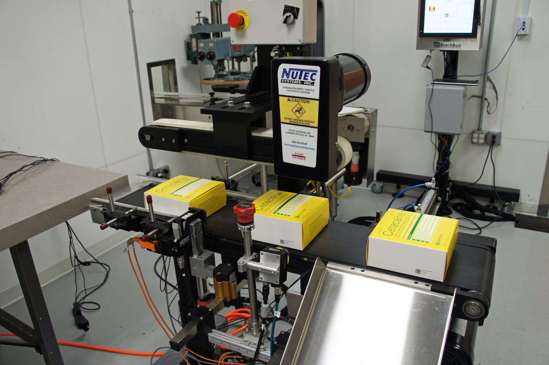 Serialized cartons are shown here as they output from the Nutec carton conveyor.