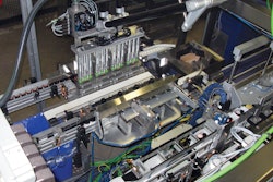 The robotic pick head of the cartoner first uses vacuum cups to pick K-Cups from the collation station.