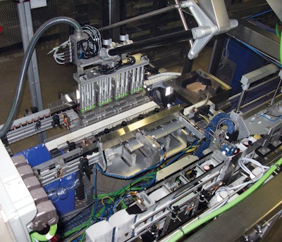 The robotic pick head of the cartoner first uses vacuum cups to pick K-Cups from the collation station.