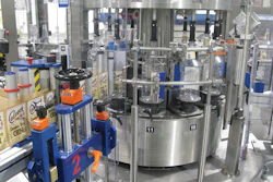 Located just ahead of the cleaner/filler/capper block on Line B, this pressure-sensitive labeler applies front, back, and neck labels if required.