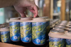 Company is reportedly the first to use the environmentally friendly E6PR ring. Made of barley and wheat ribbons used in the brewing process, it also provides the strength to hold cans through distribution.