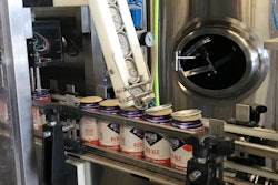 Kyle Holechek dials in his cask filler/seamer, ensuring low oxygen pickup