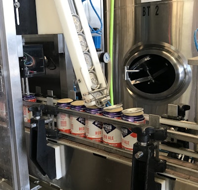 Kyle Holechek dials in his cask filler/seamer, ensuring low oxygen pickup