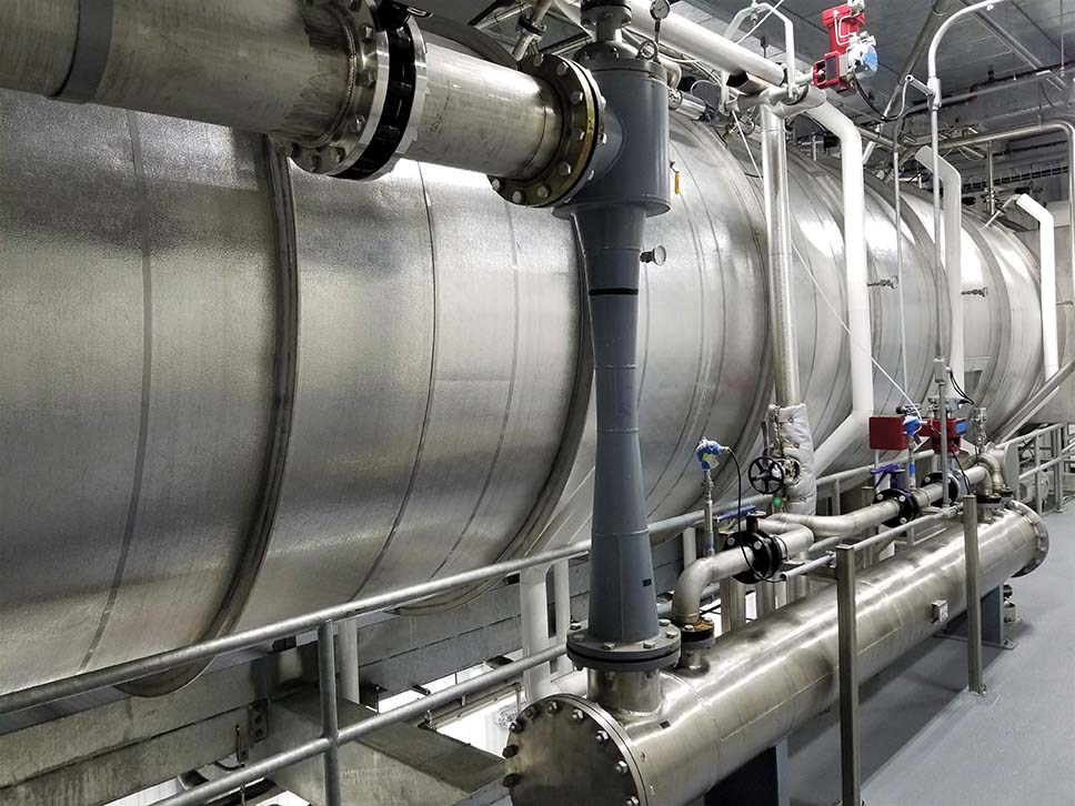 Malt Products Corporation uses its Bucher Dryband vacuum belt dryer to gently process malted barley syrup into malted barley extract with low temperatures. Photo courtesy of Malt Products Corporation.