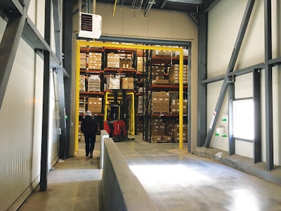 Through multiple windows, Royal Cup employees can get a view of the creek when crossing the bridge from the roasting/packaging facility to the warehouse. The internal bridge enhances production as well as storage needs. Photo by Joyce Fassl.