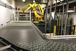 At a speed of 2.5 layers/min, the robot picks a full layer of jars from a pallet and places it on the filling line infeed.
