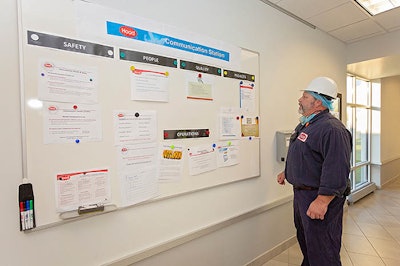 HP Hood worker at bulletin board