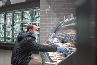 Guy With Mask Meat Dept Getty Images 1220662089