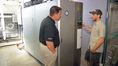 An operator adjusts the Miura LX 200 SG, which runs four days a week for 20 hours a day to produce about 360 barrels of beer per week at Yee-Haw Brewing Co.