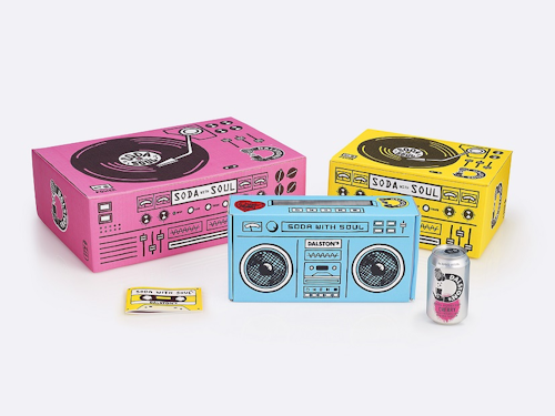 The three shippers include a 24-ct, a 12-ct, and a four-count case illustrated to resemble vintage turntables and a boombox. A booklet designed to look like a cassette tape provides an introduction to the brand and its varieties.