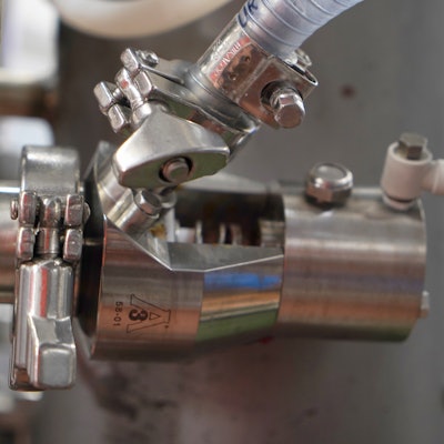 The TrueClean air blow check valve installed on a fruit line.