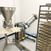 The Baker-Bot ices a full rack of 480 cookies in about 40 to 45 minutes, averaging about six seconds a cookie at Noms Bake Shop.