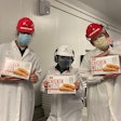 Conagra Brands’ Milwaukee plant team members Nick Thompson, Xiomaris Mendez, and Jake Rozenberg proudly display Chicken Melts products that are now more sustainably produced. Photo courtesy of Conagra Brands.