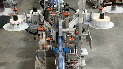 Dual-head labeler applies either wraparound or front-and-back labels.