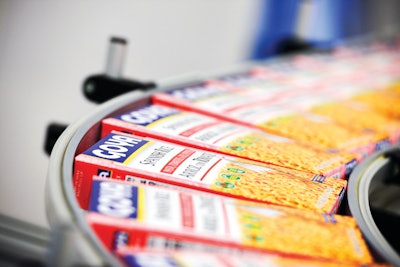 Goya Foods packages beans, rice mixes, corn meal, and other dry products at its new facility in Secaucus, N.J. Pictured here, filled and sealed packages of Spanish rice proceed to a cartoning line.