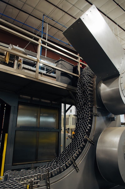 A unique lowering element uses vacuum to move cans from the depalletizer to the packaging line below, eliminating the need for changeover for different can sizes.