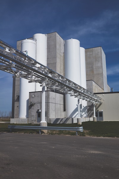 At Proliant Dairy Ingredients’ new facility in St. Johns, Mich., a pipe bridge conveys liquid milk permeate and whey permeate from the adjacent MWC plant for producing dry ingredients for feed and food applications. Photo by Thomas Kirby